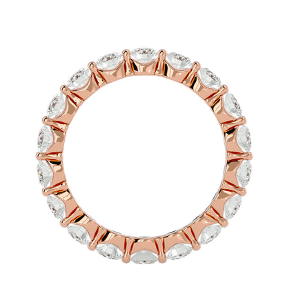 Floating prong diamond eternity ring