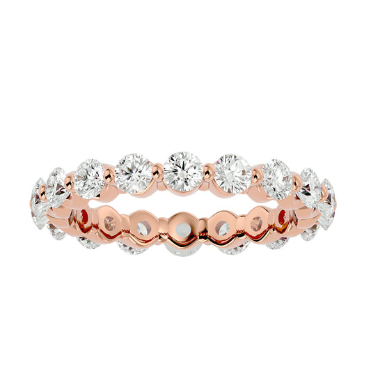 Floating prong diamond eternity ring