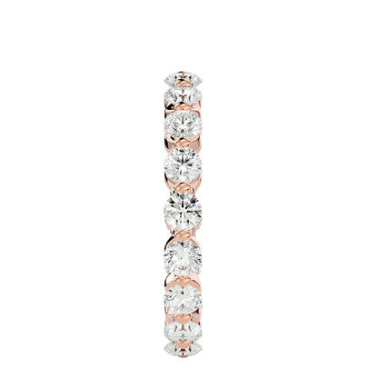 Floating prong diamond eternity ring