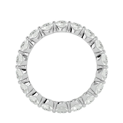 Floating prong diamond eternity ring