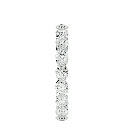 Floating prong diamond eternity ring